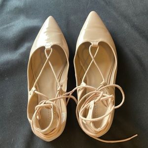 Nude lace up pointy toe flats